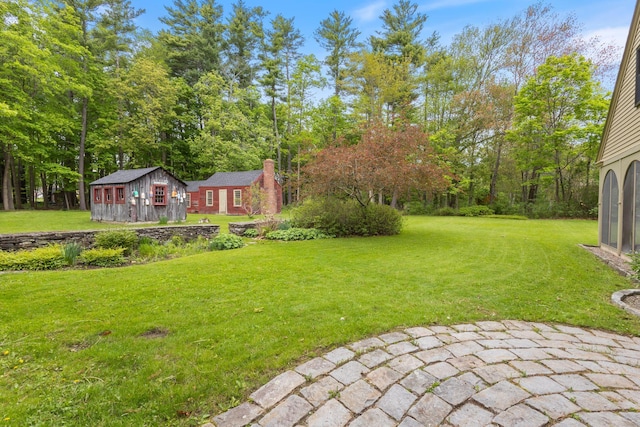 18 Laurel Ln, Eliot, ME 03903 - view of green lawn featuring an outbuilding