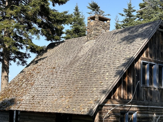 734 Duck Cove Rd, Roque Bluffs, ME 04654 - exterior view of a chimney and roof with shingles