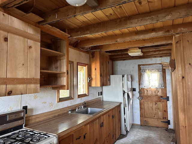 734 Duck Cove Rd, Roque Bluffs, ME 04654 - kitchen with a sink, gas stove, healthy amount of natural light, light flooring, and wallpapered walls