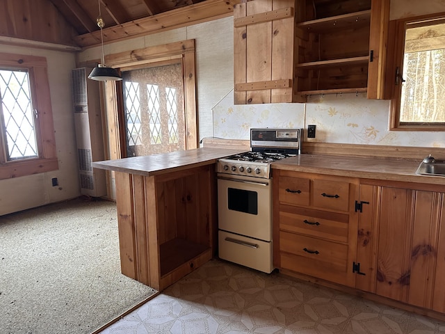 734 Duck Cove Rd, Roque Bluffs, ME 04654 - kitchen with gas range oven, lofted ceiling, open shelves, light flooring, and a heating unit