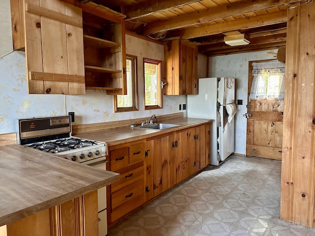 734 Duck Cove Rd, Roque Bluffs, ME 04654 - kitchen with a sink, light flooring, gas range, freestanding refrigerator, and wood counters