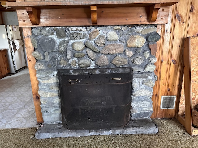 734 Duck Cove Rd, Roque Bluffs, ME 04654 - detailed view of freestanding refrigerator and a fireplace