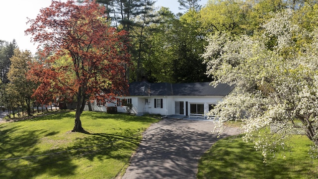 13 Packard Ave, Norway, ME 04268 - ranch-style home with driveway and a front lawn