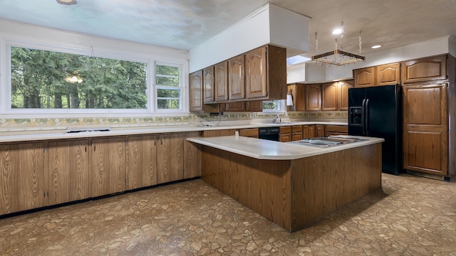 13 Packard Ave, Norway, ME 04268 - kitchen featuring black appliances, light countertops, a peninsula, a sink, and light stone finish floors