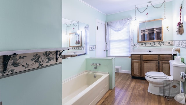 13 Packard Ave, Norway, ME 04268 - full bath with a bath, wood finished floors, ornamental molding, vanity, and toilet
