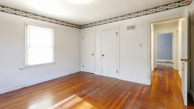 13 Packard Ave, Norway, ME 04268 - unfurnished bedroom featuring wood finished floors and baseboards