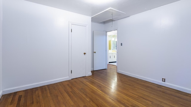 13 Packard Ave, Norway, ME 04268 - spare room featuring attic access, wood finished floors, and baseboards