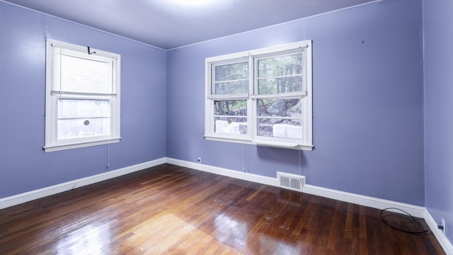 13 Packard Ave, Norway, ME 04268 - empty room with plenty of natural light, wood finished floors, and baseboards
