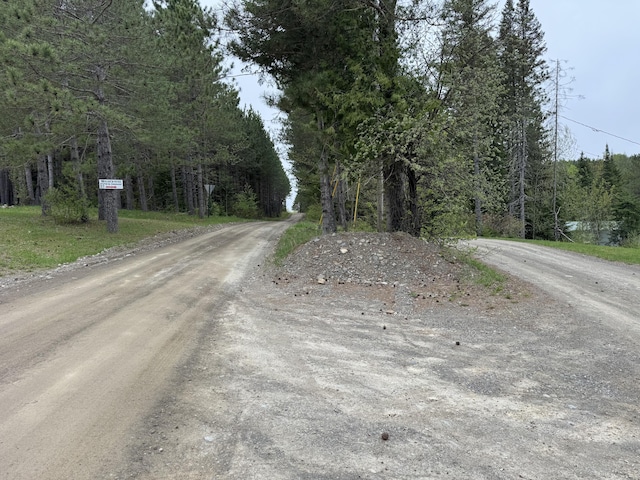 135 W Conroy Lake Rd, Monticello, ME 04760 - view of dirt / gravel road with a forest view