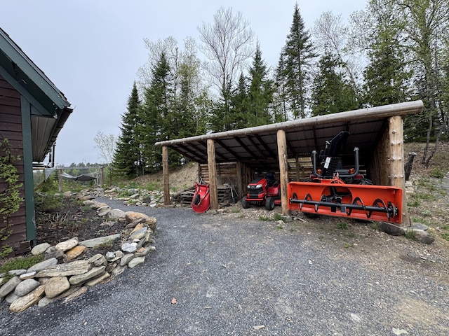 135 W Conroy Lake Rd, Monticello, ME 04760 - view of parking / parking lot featuring a carport and a pole building