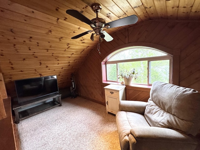 135 W Conroy Lake Rd, Monticello, ME 04760 - sitting room with wood ceiling, vaulted ceiling, wood walls, ceiling fan, and light carpet