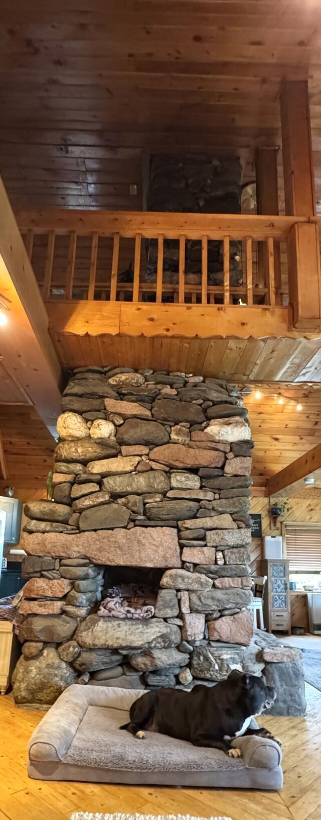 135 W Conroy Lake Rd, Monticello, ME 04760 - detailed view of wood ceiling, a fireplace, wood finished floors, and wood walls