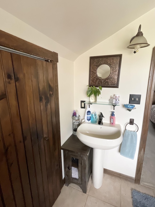 135 W Conroy Lake Rd, Monticello, ME 04760 - bathroom with tile patterned flooring and vaulted ceiling