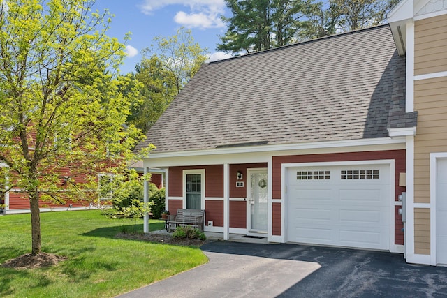30 Agatha James Dr Unit 11, Kennebunk, ME 04043 - view of front of house with roof with shingles, a front yard, an attached garage, and covered porch