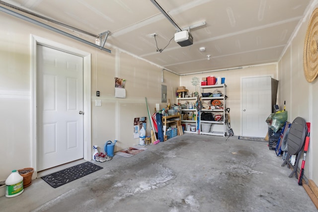30 Agatha James Dr Unit 11, Kennebunk, ME 04043 - garage with electric panel and a garage door opener