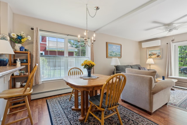 30 Agatha James Dr Unit 11, Kennebunk, ME 04043 - dining area with a baseboard heating unit, a wall mounted air conditioner, wood finished floors, a ceiling fan, and a chandelier