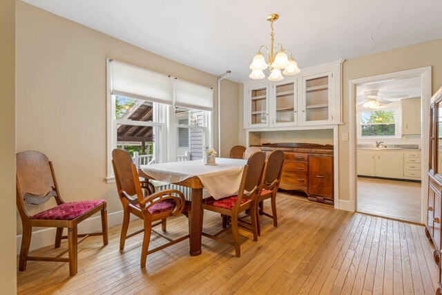 24 Emery Corner Rd, Limerick, ME 04048 - dining space featuring light wood-style floors, a chandelier, and plenty of natural light