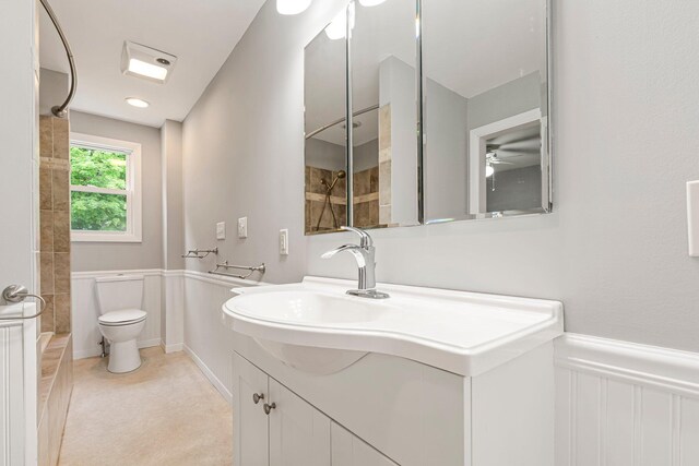24 Emery Corner Rd, Limerick, ME 04048 - full bath with tiled shower, vanity, and wainscoting