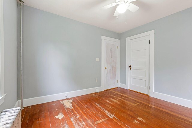 24 Emery Corner Rd, Limerick, ME 04048 - spare room with radiator, a ceiling fan, and hardwood / wood-style flooring