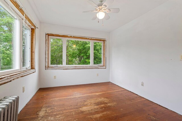 24 Emery Corner Rd, Limerick, ME 04048 - spare room with radiator heating unit, plenty of natural light, and a ceiling fan