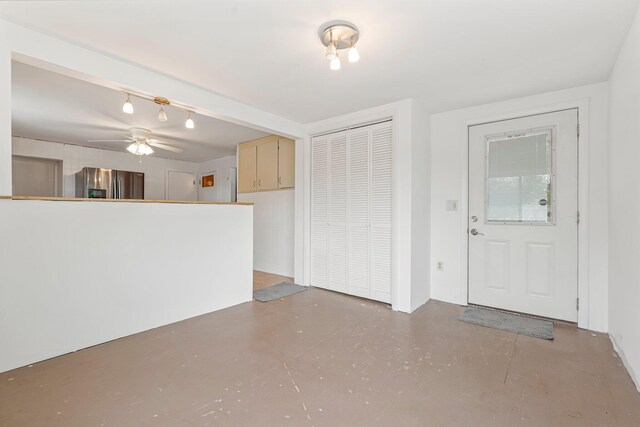 24 Emery Corner Rd, Limerick, ME 04048 - unfurnished living room with concrete floors and ceiling fan
