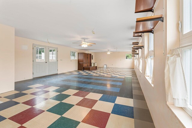24 Emery Corner Rd, Limerick, ME 04048 - unfurnished living room featuring tile patterned floors and a ceiling fan