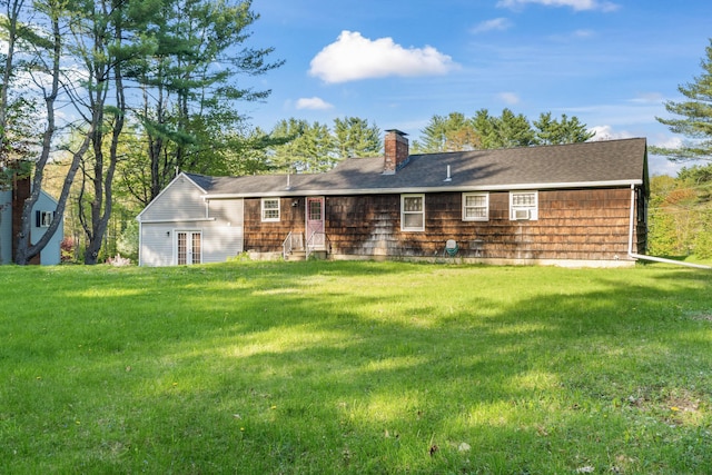 20 Sunderland Dr, Auburn, ME 04210 - rear view of house with a chimney, a yard, and french doors