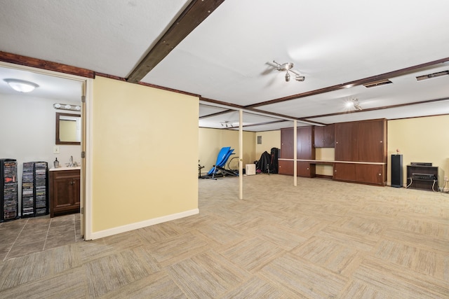 20 Sunderland Dr, Auburn, ME 04210 - finished below grade area with carpet floors, a sink, and baseboards