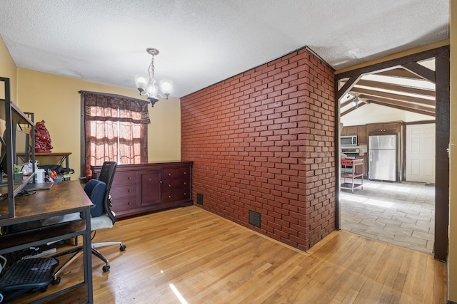 20 Sunderland Dr, Auburn, ME 04210 - office featuring light wood-style flooring, a chandelier, brick wall, and a textured ceiling