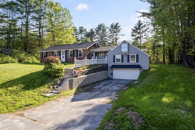 20 Sunderland Dr, Auburn, ME 04210 - single story home featuring driveway, an attached garage, a front yard, and stairs