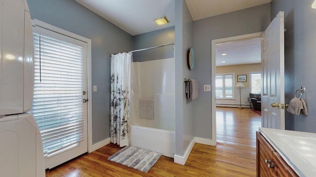 72 Sand Beach Rd, Standish, ME 04084 - full bath featuring wood finished floors, shower / bath combo with shower curtain, baseboards, vanity, and baseboard heating