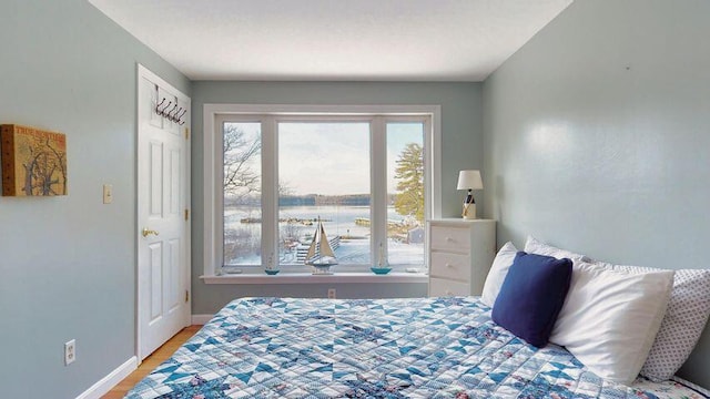 72 Sand Beach Rd, Standish, ME 04084 - bedroom with wood finished floors and baseboards