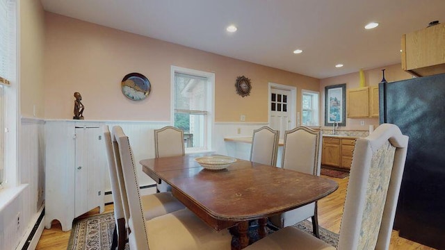 72 Sand Beach Rd, Standish, ME 04084 - dining space featuring baseboard heating, wainscoting, light wood-style flooring, plenty of natural light, and recessed lighting