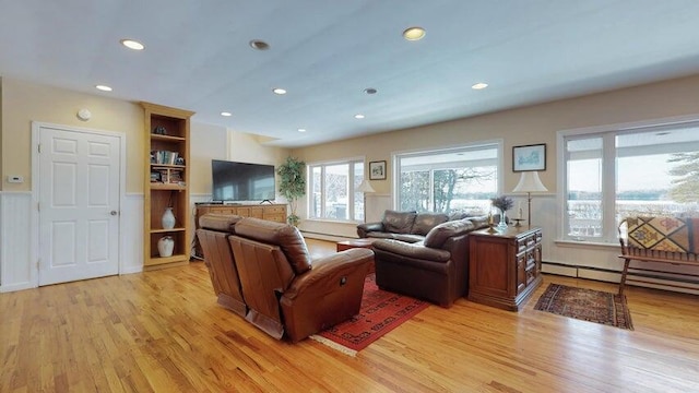 72 Sand Beach Rd, Standish, ME 04084 - living area featuring a baseboard heating unit, light wood finished floors, and recessed lighting