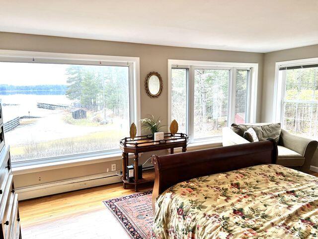 72 Sand Beach Rd, Standish, ME 04084 - bedroom with a baseboard radiator and light wood finished floors