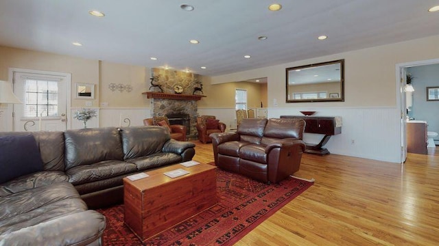 72 Sand Beach Rd, Standish, ME 04084 - living area featuring a wainscoted wall, light wood-style floors, a fireplace, and recessed lighting