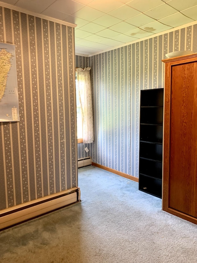 11 Brewster Rd, Eastport, ME 04631 - unfurnished room featuring baseboard heating and carpet flooring