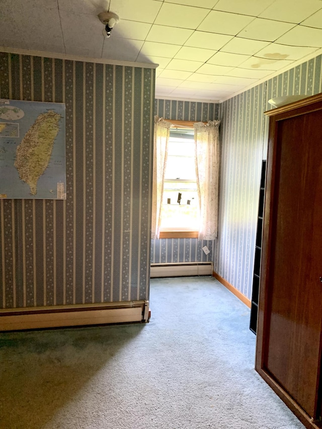 11 Brewster Rd, Eastport, ME 04631 - unfurnished bedroom featuring carpet, a baseboard radiator, and wallpapered walls