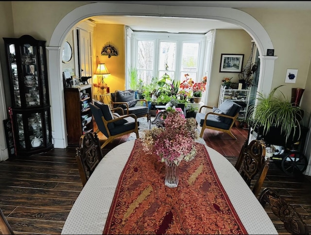 29 Fish Point Rd, Orland, ME 04472 - dining space with arched walkways and hardwood / wood-style floors