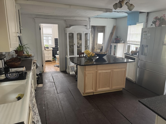 29 Fish Point Rd, Orland, ME 04472 - kitchen with stainless steel fridge with ice dispenser, dark wood finished floors, light brown cabinetry, and plenty of natural light