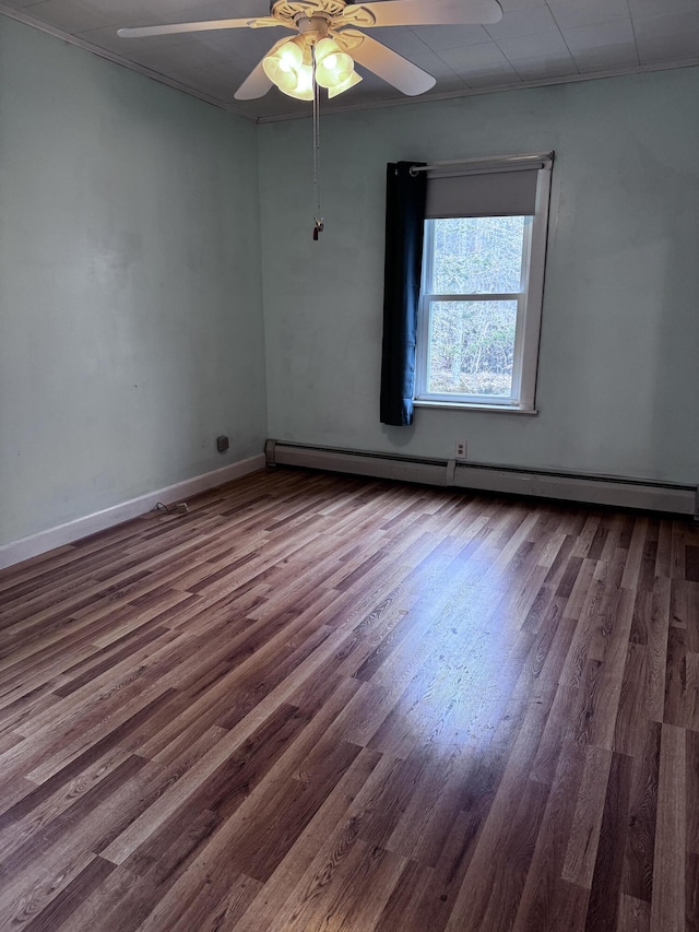 1596 Bald Mountain Rd, Orland, ME 04472 - unfurnished room featuring wood finished floors, ceiling fan, a baseboard heating unit, and baseboards