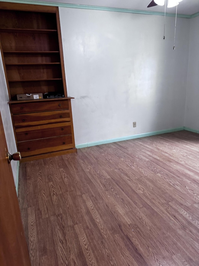 1596 Bald Mountain Rd, Orland, ME 04472 - empty room with wood finished floors, ceiling fan, and baseboards