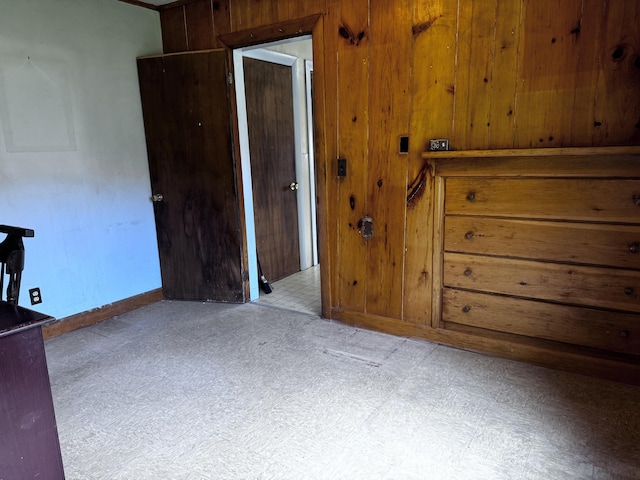 1596 Bald Mountain Rd, Orland, ME 04472 - bedroom featuring tile patterned floors, wooden walls, and baseboards