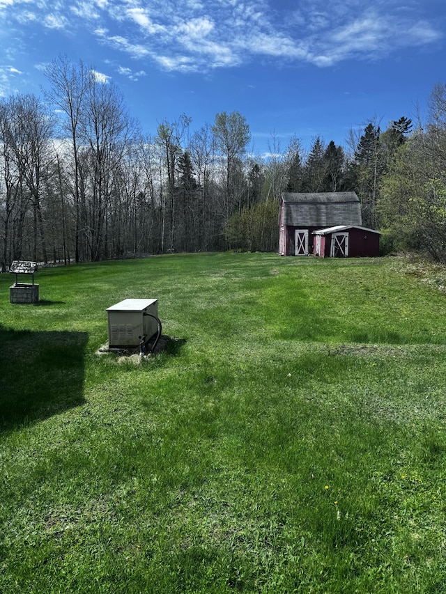 1596 Bald Mountain Rd, Orland, ME 04472 - view of grassy yard featuring a barn and an outbuilding