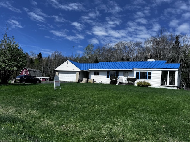 1596 Bald Mountain Rd, Orland, ME 04472 - single story home with an attached garage, a front yard, and metal roof