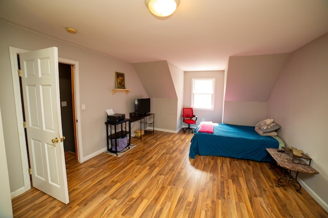 51 Brookview Dr, Bucksport, ME 04416 - bedroom featuring wood finished floors and vaulted ceiling