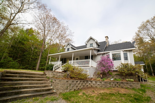51 Brookview Dr, Bucksport, ME 04416 - view of front of house featuring stairs, a porch, a chimney, and a shingled roof