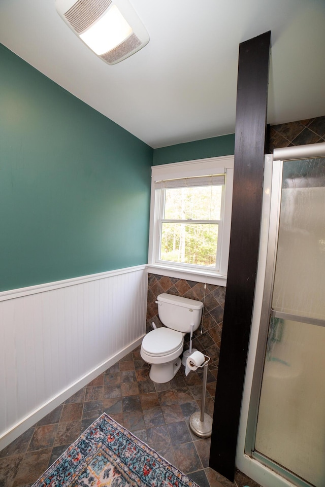 51 Brookview Dr, Bucksport, ME 04416 - full bath with a shower stall, wainscoting, and stone finish flooring