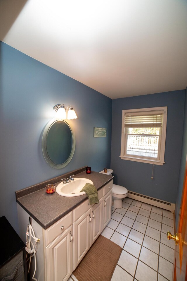 51 Brookview Dr, Bucksport, ME 04416 - bathroom featuring baseboard heating, vanity, and tile patterned floors