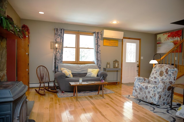 51 Brookview Dr, Bucksport, ME 04416 - living room featuring a wall mounted air conditioner, light wood-style flooring, baseboard heating, and recessed lighting